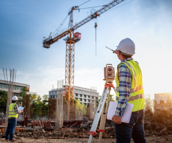 Surveyor equipment. Surveyorâ€™s telescope at construction site or Surveying for making contour plans is a graphical representation of the lay of the land startup construction work.